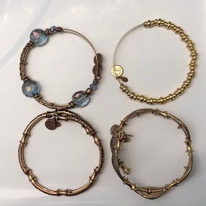 4 gold tone Alex and Ani bangles